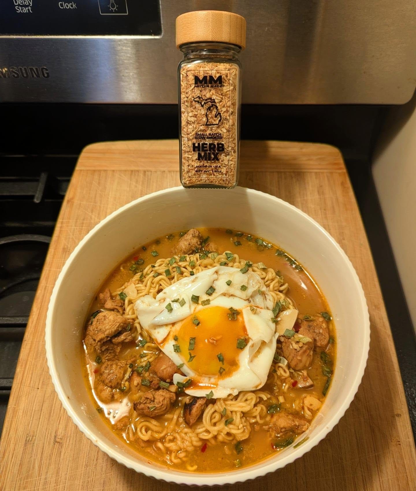 spicy ramen 🍜 extra chicken, runny yolk egg and roasted herb mix for extra flavor 🙂